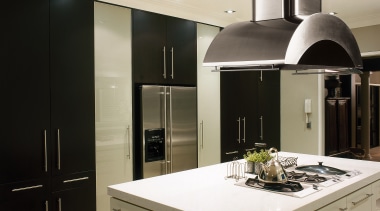 Kitchen with black and white cabinetry, white island countertop, home appliance, interior design, kitchen, gray, black