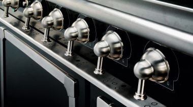 Closeup view of cooker control handles. - Closeup automotive design, car, metal, motor vehicle, black, gray