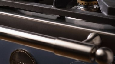 Closeup view of cooktop and control handles for black