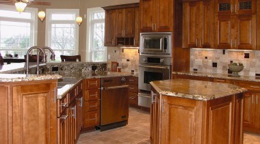 Kitchen with timber cabinetry, granite countertops, stainless steel cabinetry, countertop, cuisine classique, floor, flooring, hardwood, home, interior design, kitchen, room, wood, wood flooring, wood stain, brown