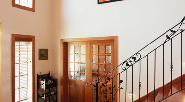 Stairway and entrance of home with natural wall baluster, estate, handrail, home, interior design, property, real estate, stairs, window, white