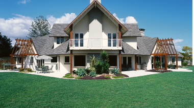 Exterior view of two storey home with shingle cottage, estate, facade, farmhouse, grass, home, house, lawn, mansion, property, real estate, residential area, roof, siding, sky, suburb, villa, window, green
