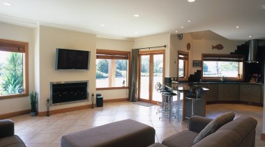 Open plan kitchen and lounge area with cream ceiling, floor, flooring, home, interior design, living room, property, real estate, room, window, gray