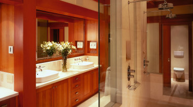 view of this bathroom featuring cherry wood vanity/cabinetry, bathroom, cabinetry, ceiling, countertop, interior design, kitchen, room, brown, red