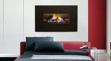 Fireplace with dark surround set into white wall, bed, bed frame, couch, fireplace, furniture, hearth, interior design, mattress, sofa bed, white