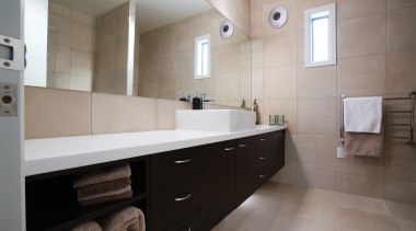 view of this clean smooth bathroom, the large architecture, bathroom, bathroom cabinet, cabinetry, countertop, floor, flooring, home, interior design, kitchen, property, real estate, room, sink, tile, gray