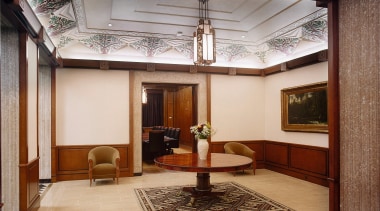 A view of the lobby area. - A ceiling, floor, flooring, interior design, living room, lobby, gray, brown
