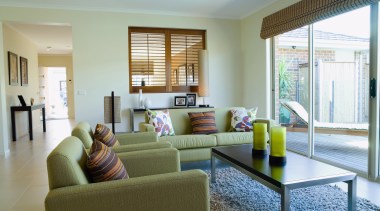 Lounge room with green sofas and chairs, stainless apartment, estate, home, house, interior design, living room, property, real estate, room, window, gray