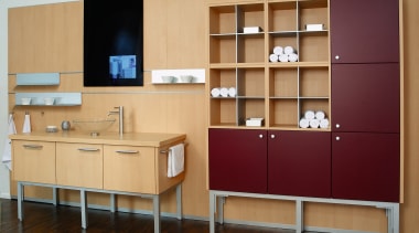 view of this bathroom featuring dark stained timber bookcase, cabinetry, chest of drawers, cupboard, furniture, shelf, shelving, orange, red