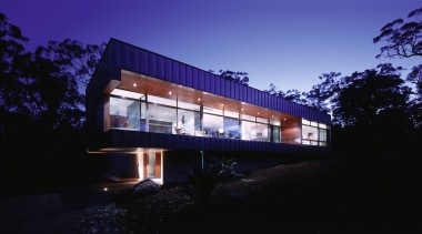 Exterior view of large home with expansive glazing architecture, building, corporate headquarters, facade, home, house, lighting, night, property, real estate, reflection, residential area, sky, blue, black