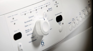 A view of a dryer. - A view design, font, home appliance, major appliance, product, product design, washing machine, white