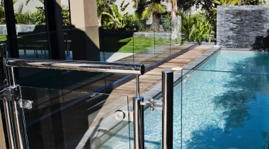 A view of some balustrades from ProStainless. - house, outdoor structure, property, real estate, reflection, sky, swimming pool, water, black