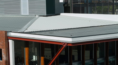 Exterior view of building showing grey roofing, and architecture, building, city, daylighting, facade, house, metropolitan area, residential area, roof, urban area, window, black