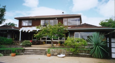 A view of a home architecturally designed by arecales, cottage, estate, facade, hacienda, home, house, outdoor structure, palm tree, property, real estate, residential area, resort, roof, tree, villa