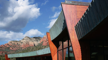 A view of an entrance way designed by architecture, building, cloud, facade, house, landmark, roof, sky, wood, black