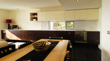 Apartment dining and kitchen area with long kitchen apartment, countertop, floor, flooring, interior design, kitchen, property, real estate, room, black, orange