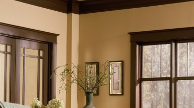 A view of a ceiling fan by Fanimation. ceiling, ceiling fan, chandelier, dining room, home, interior design, light fixture, lighting, living room, room, window, brown