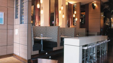 view of the bar and seating areas featuring furniture, interior design, lobby, restaurant, table, black