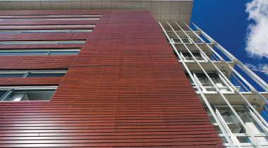 An exterior view of the cedar cladding. - architecture, brick, brickwork, building, commercial building, corporate headquarters, daylighting, daytime, facade, landmark, line, roof, siding, sky, structure, wall, wood, red