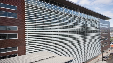 A view of the louvres. - A view architecture, building, commercial building, corporate headquarters, daylighting, facade, headquarters, house, line, metropolitan area, real estate, residential area, roof, siding, structure, window, window covering, gray, black, white