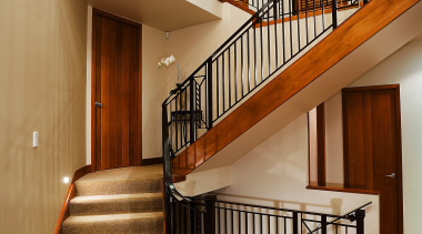 A view of a staircase from Knob's &amp; architecture, baluster, ceiling, daylighting, estate, floor, flooring, handrail, hardwood, home, interior design, lobby, real estate, stairs, wood, wood flooring, brown