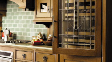 view of this kitchen featuring stainless steel wolf cabinetry, countertop, cuisine classique, furniture, home appliance, kitchen, brown