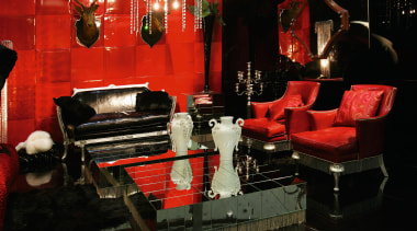 view of the living area featuring red and furniture, interior design, lighting, living room, room, black, red