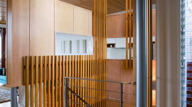 view of the hall/stairway featuring timber flooring, steel architecture, ceiling, floor, flooring, hardwood, house, interior design, lobby, real estate, stairs, wood, wood flooring, brown