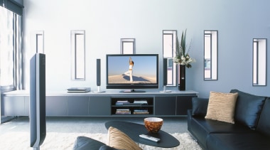 A view of a home entertainment system from furniture, interior design, living room, room, table, white, black