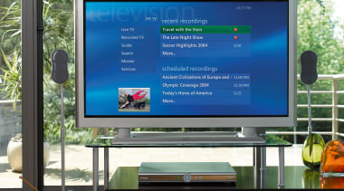 view of this living area featuring green coffee advertising, computer monitor, display advertising, display device, flat panel display, lcd tv, led backlit lcd display, media, multimedia, screen, technology, television, television set