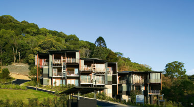 Exterior view of this new apartment block  architecture, building, condominium, cottage, estate, home, house, plant, property, real estate, residential area, sky, tree, villa, teal, brown