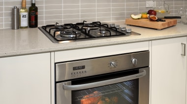 Traditional farmhouse style kitchen by Kitchen Focus countertop, gas stove, home appliance, kitchen, kitchen appliance, kitchen stove, major appliance, microwave oven, oven, white