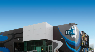 view of the less mills building constructed by architecture, building, car, commercial building, corporate headquarters, facade, motor vehicle, sky, blue