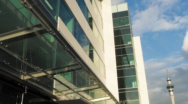 A view of the AirNZ building. - A architecture, building, city, commercial building, condominium, corporate headquarters, daytime, downtown, facade, headquarters, infrastructure, metropolis, metropolitan area, mixed use, real estate, reflection, residential area, sky, skyscraper, structure, tower block, urban area, black