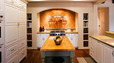 The cooking centre in the kitchen is positioned cabinetry, countertop, flooring, home appliance, interior design, kitchen, room, orange, gray, brown