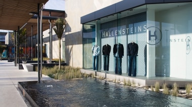 A view of a water feature by Mayfair architecture, building, reflection, structure, black