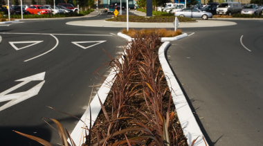 A view of some landscaping by Mace Contractors. asphalt, car, grass, lane, plant, road, sky, tree, vehicle, black, gray