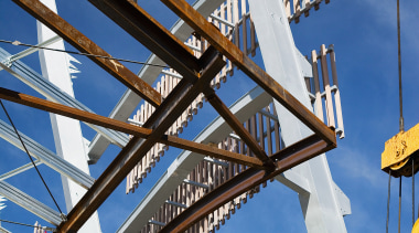 A view of a structure by Auckland Steel. architecture, bridge, building, cable stayed bridge, fixed link, girder bridge, landmark, sky, structure, windmill, blue