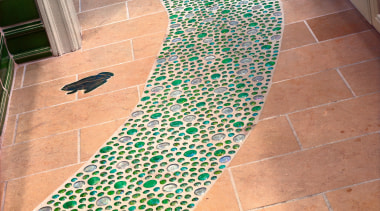 view of the glass and ceramic path in floor, flooring, tile, orange