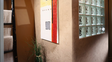 A view of some artwork in the bathroom. furniture, interior design, shelf, shelving, brown, gray