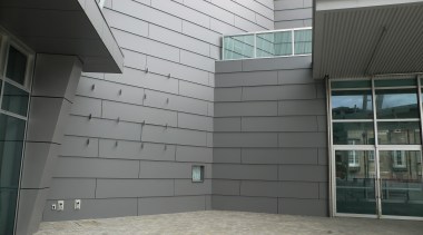 A view of the Vector Arena. - A architecture, building, daylighting, facade, glass, siding, structure, wall, window, gray, black