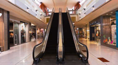 A view of a mechanical feature in Sylvia building, escalator, interior design, lobby, outlet store, retail, shopping, shopping mall, gray, black