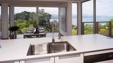 A view of a kitchen, cabinetry, glass benchtops, countertop, kitchen, property, real estate, window, white, gray