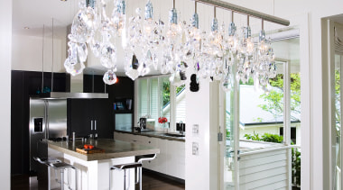 A view of the kitchen and dining areas, ceiling, chandelier, countertop, home, interior design, kitchen, light fixture, lighting, gray, white