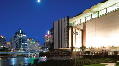 A view of the two buildings which form architecture, building, city, cityscape, condominium, corporate headquarters, downtown, evening, hotel, lighting, metropolis, metropolitan area, mixed use, night, real estate, reflection, sky, skyline, skyscraper, urban area, water, blue