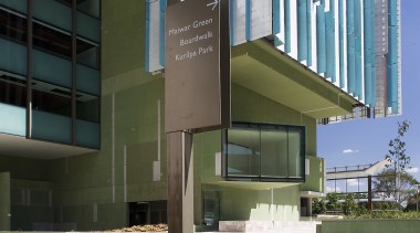 A view of some signage by Dot Dash. architecture, building, commercial building, condominium, corporate headquarters, daytime, headquarters, metropolitan area, mixed use, real estate, residential area, white