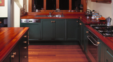 A view of some kitchen cabinetry by Kings cabinetry, countertop, cuisine classique, floor, flooring, furniture, hardwood, interior design, kitchen, room, wood, wood flooring, wood stain, red, black
