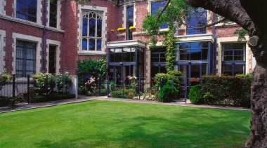 A view of the Peterborough Apartments,  architect architecture, backyard, building, cottage, courtyard, estate, facade, garden, grass, historic house, home, house, landscaping, lawn, mansion, neighbourhood, plant, plantation, property, real estate, residential area, tree, window, yard, green