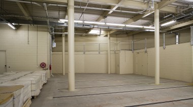 View of the new basement storage area in floor, flooring, structure, warehouse, gray, brown