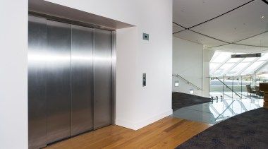 A view of an elevator supplied by Otis architecture, ceiling, door, floor, glass, house, interior design, real estate, white, gray